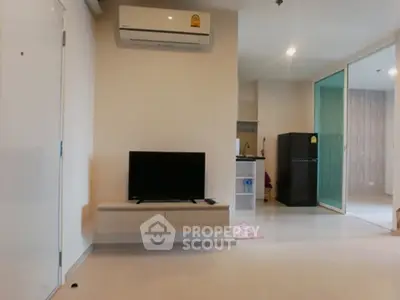 Modern living room with air conditioning and sleek TV setup