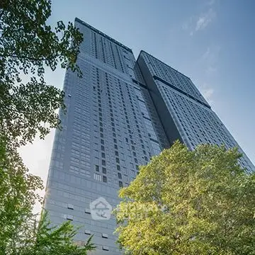 Stunning high-rise building with modern architecture and lush greenery