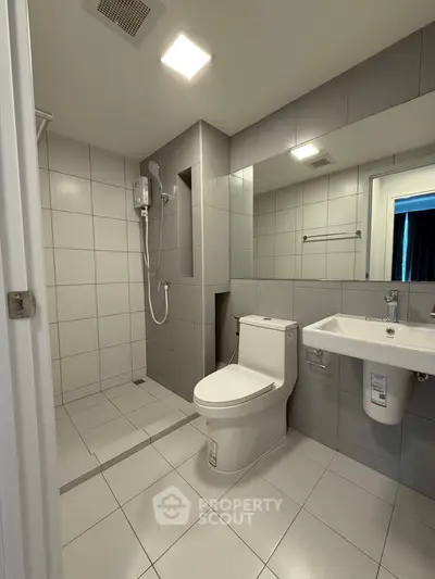 Modern bathroom with sleek tiles and contemporary fixtures