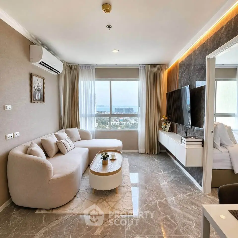 Luxurious living room with modern decor and stunning city view, featuring elegant furniture and ambient lighting.