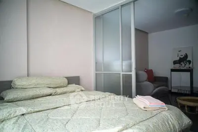 Cozy bedroom with modern sliding glass doors and stylish decor