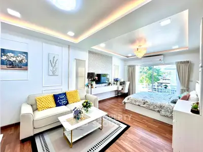 Luxurious open-plan living room with elegant decor and natural light