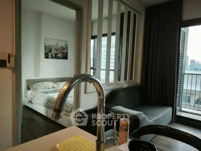Modern apartment interior with open kitchen and cozy bedroom view