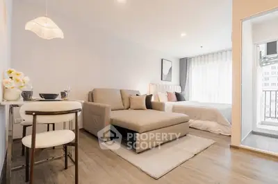 Modern studio apartment with cozy living area and stylish decor