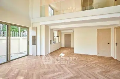 Spacious modern living room with elegant wooden flooring and open layout