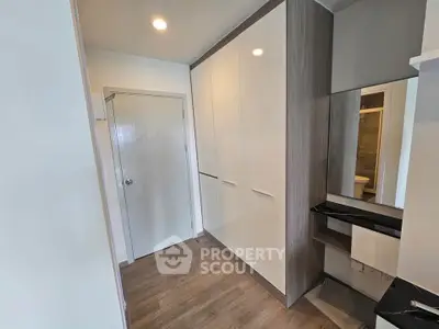 Modern storage space with sleek cabinets and elegant flooring