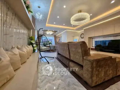 Luxurious living room with elegant chandelier and modern decor