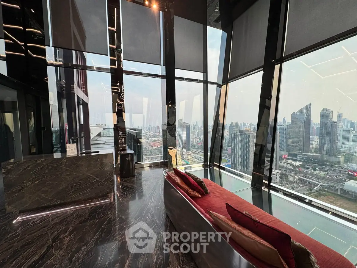 Luxurious high-rise living room with panoramic city views and modern design.