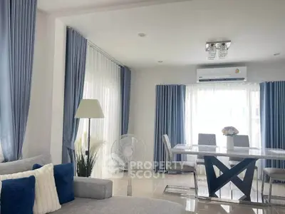 Elegant living room with modern dining area and stylish decor