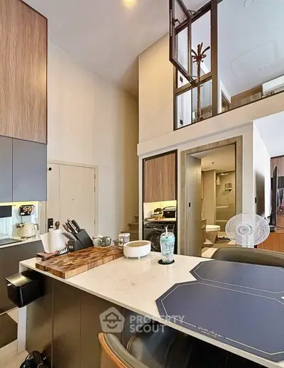 Modern kitchen with open layout and stylish decor in a contemporary apartment.