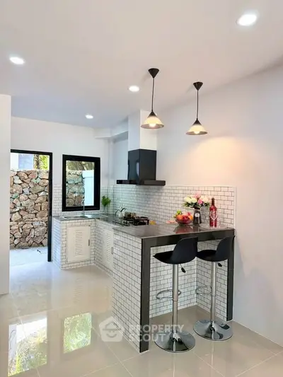 Modern kitchen with open layout and stylish bar seating