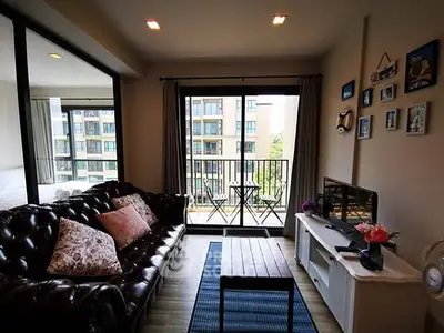 Charming living room with balcony view in modern apartment
