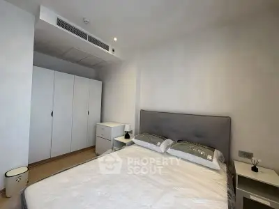 Modern bedroom with sleek design and ample storage space