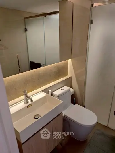 Modern bathroom with sleek fixtures and ambient lighting
