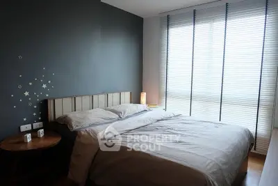 Cozy modern bedroom with stylish decor and natural light