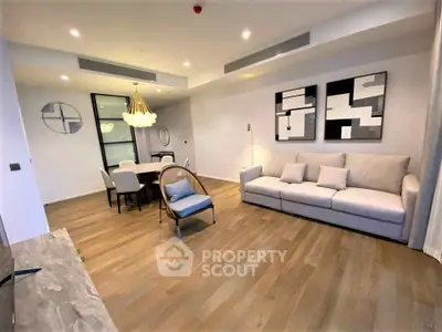 Spacious modern living room with elegant decor and wooden flooring