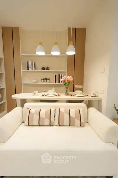 Chic modern living room with cozy sofa and elegant dining setup, perfect for urban living.