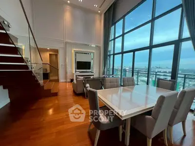 Luxurious living room with high ceilings and stunning city view