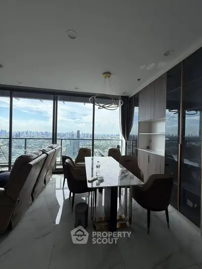 Luxurious high-rise living room with stunning city view and elegant dining area.