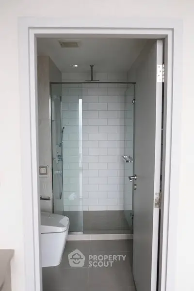 Modern bathroom with glass shower and sleek fixtures