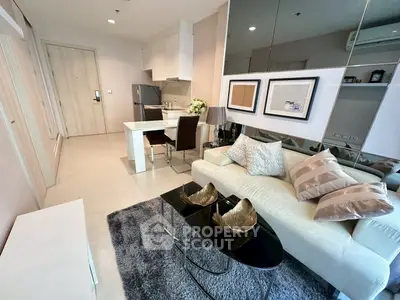 Modern living room with stylish decor and open kitchen layout