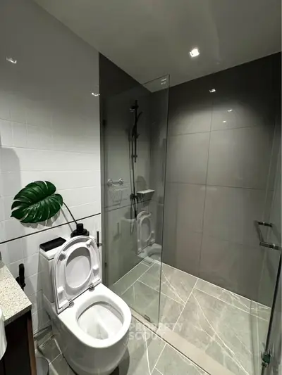Modern bathroom with sleek glass shower and contemporary fixtures