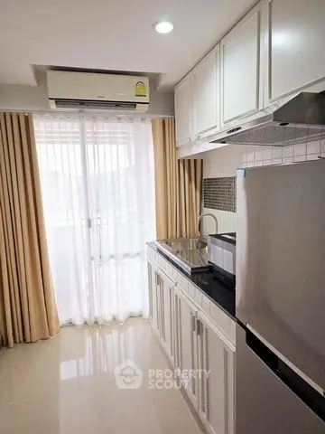 Modern kitchen with sleek cabinets and natural light