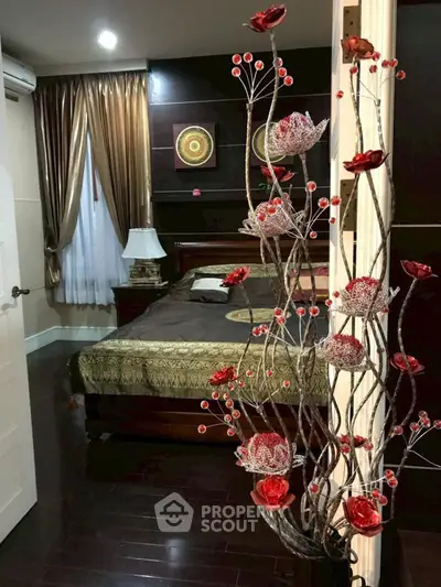 Luxurious bedroom with elegant decor and rich wooden flooring