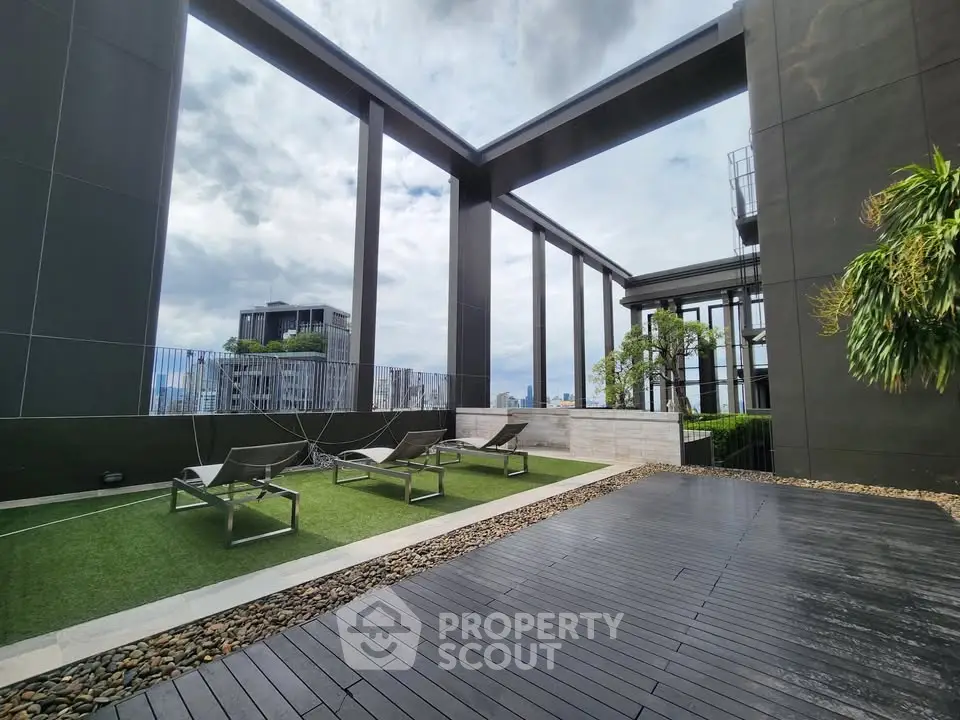 Luxurious rooftop terrace with stunning city views and modern lounge chairs.