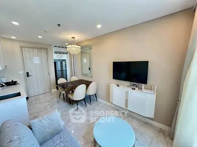 Modern living room with elegant dining area and wall-mounted TV in a stylish apartment.