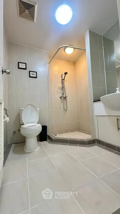 Modern bathroom with walk-in shower and sleek fixtures