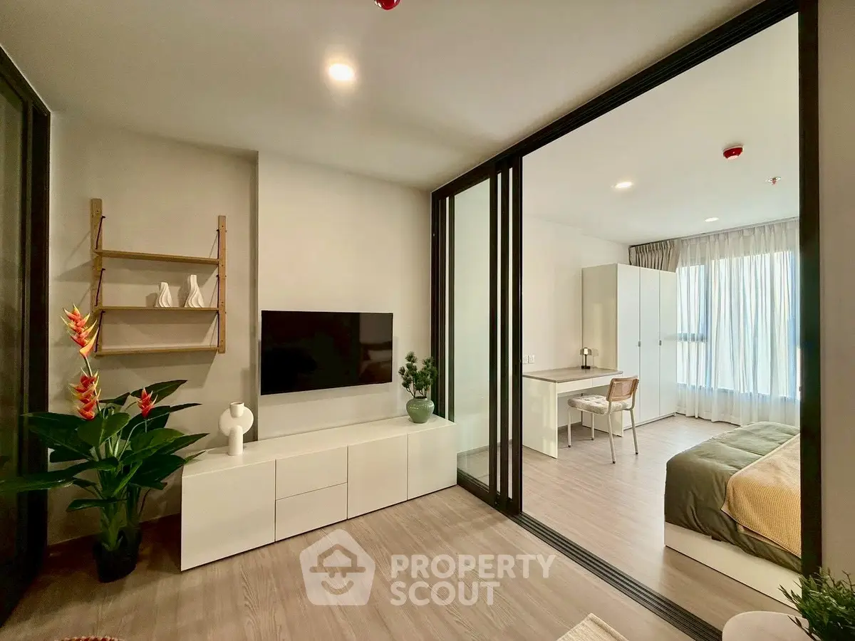 Modern open-plan living room with sleek design and natural light