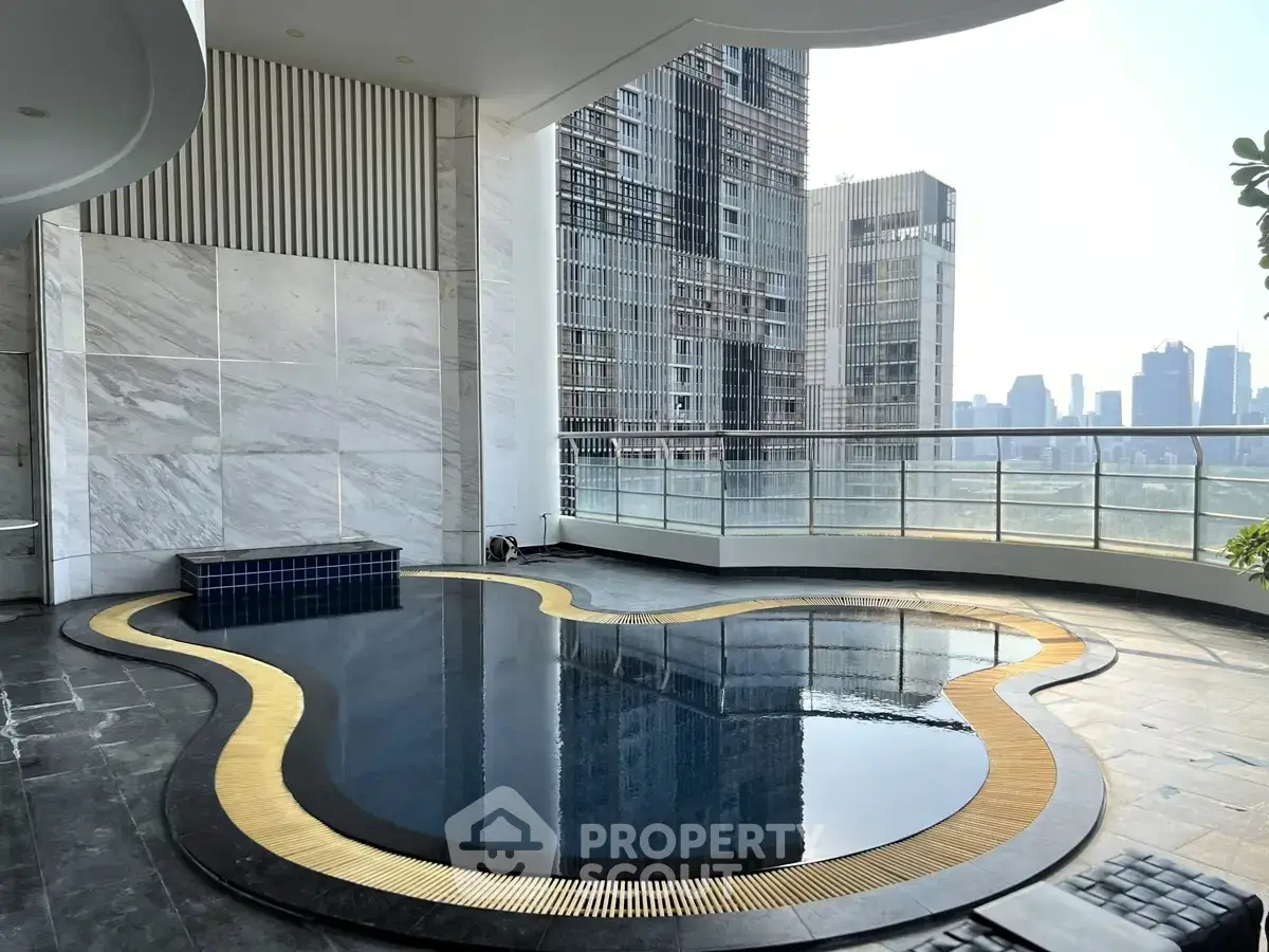 Luxurious rooftop pool with stunning city skyline view in modern high-rise building.