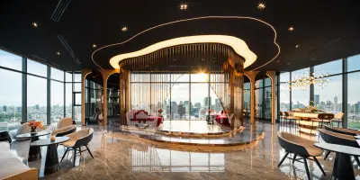Luxurious high-rise living room with panoramic city views and modern design.