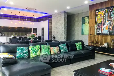 Spacious modern living room with stylish decor and open kitchen layout