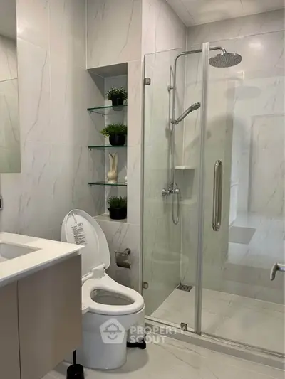 Modern bathroom with glass shower and sleek fixtures