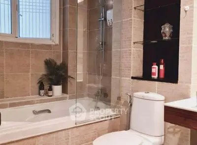 Modern bathroom with bathtub and elegant tile design