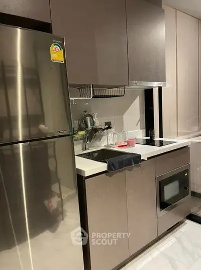 Modern kitchen with sleek cabinetry and stainless steel appliances