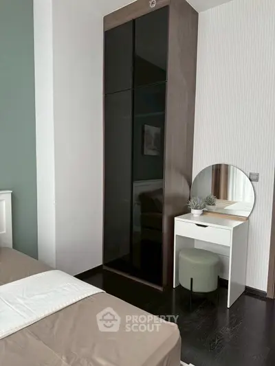 Modern bedroom with sleek wardrobe and stylish vanity area