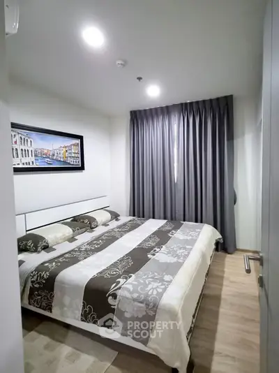 Cozy bedroom with modern decor and ample natural light