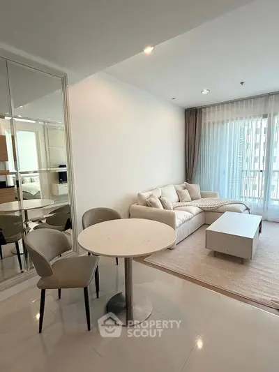 Modern living room with cozy seating and natural light