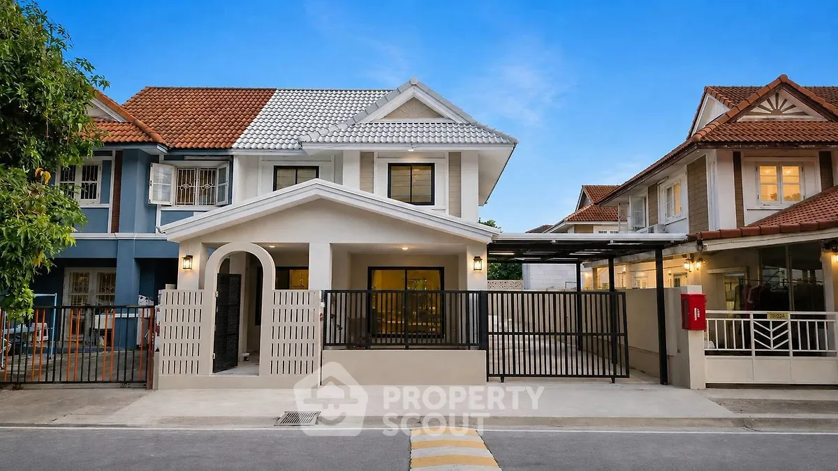 Charming suburban house with modern facade and gated driveway in a peaceful neighborhood.