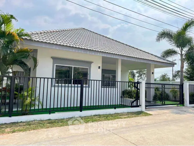 Charming single-story home with modern design and lush greenery, perfect for serene living.