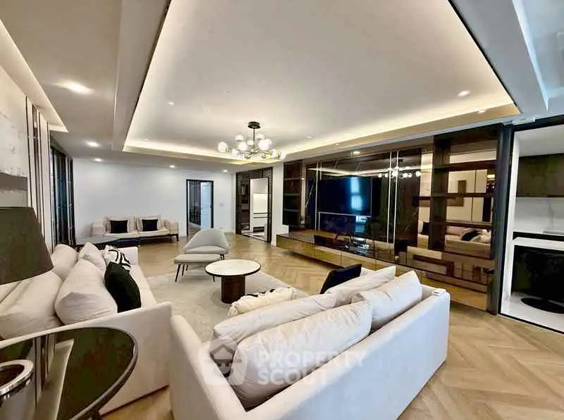 Luxurious modern living room with elegant lighting and spacious seating area.