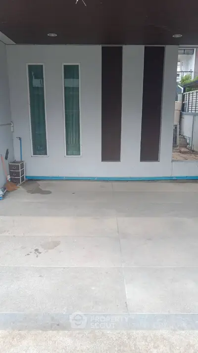 Modern building entrance with sleek design and large windows