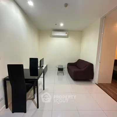 Modern living room with sleek furniture and air conditioning in a cozy apartment.