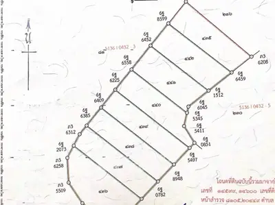 Detailed land plot map with boundary lines and plot numbers for real estate development.