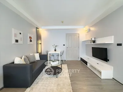 Modern living room with sleek furniture and stylish decor, perfect for contemporary urban living.