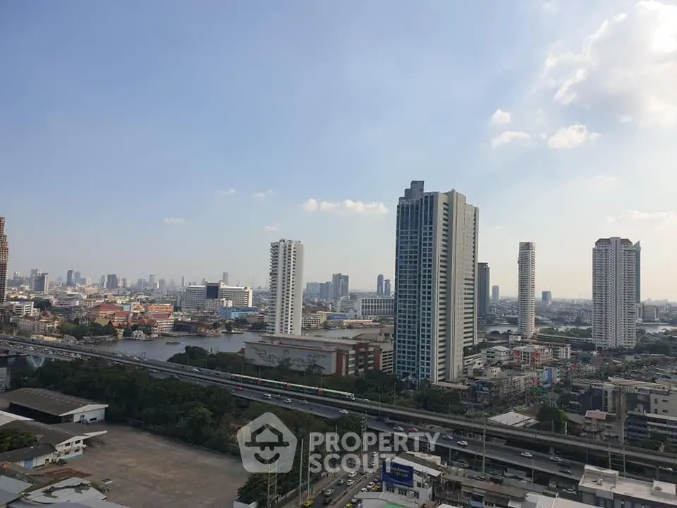 Stunning cityscape view with modern high-rise buildings and clear blue sky, perfect for urban living enthusiasts.