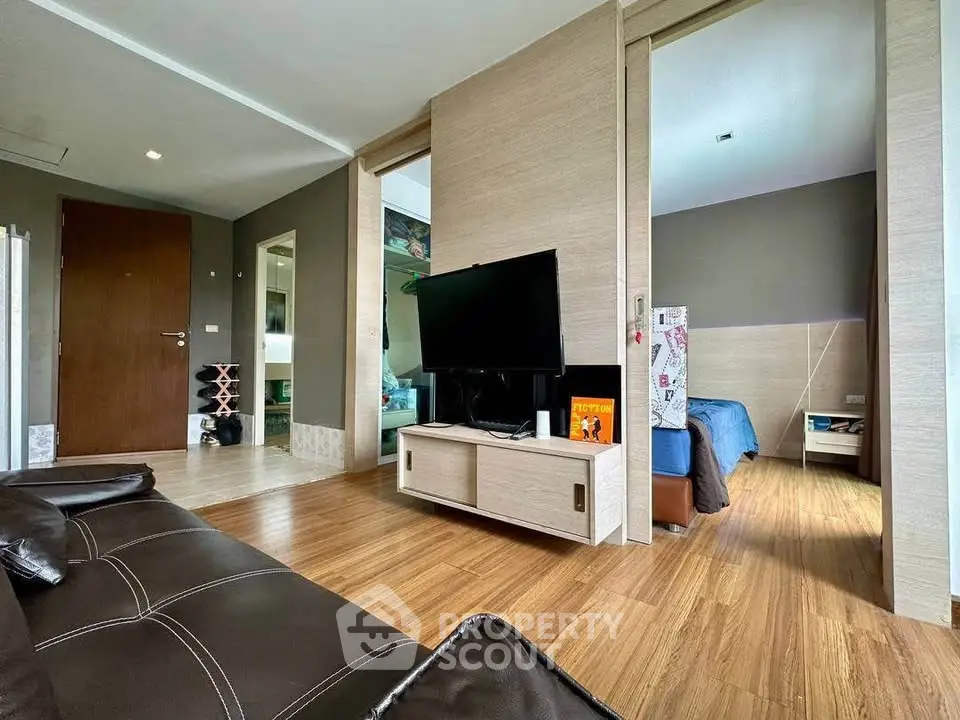 Modern living room with sleek design and wooden flooring
